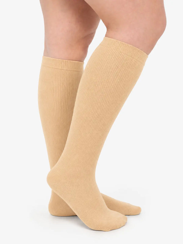Beige knee-high compression socks for wide calves — 15–25 mmHg graduated, fits a calf up to 28 inches