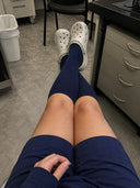 Verified customer wearing The Well Socks knee-high compression socks at home
