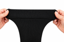 Hands stretching the wide top cuff of a plus size compression sock — super-stretch knit