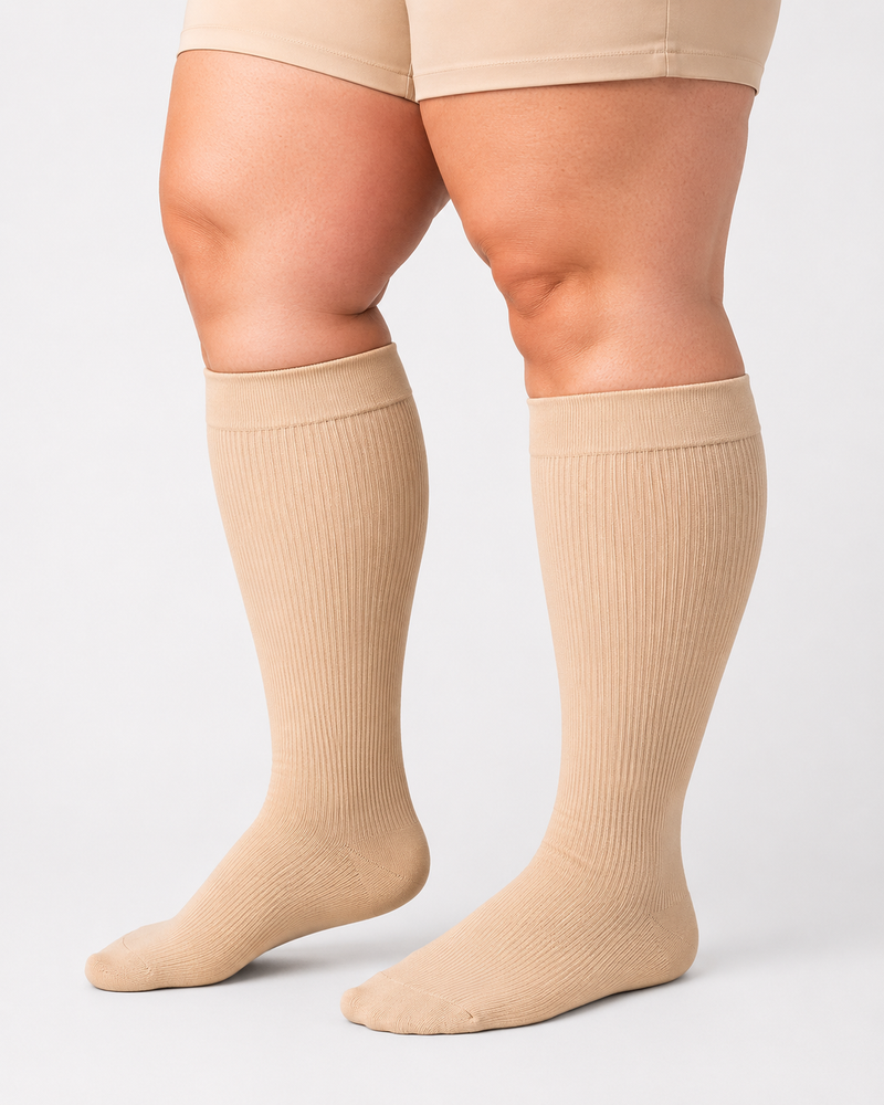 Beige plus size wide calf compression socks on full calves plus size wide calf compression socks