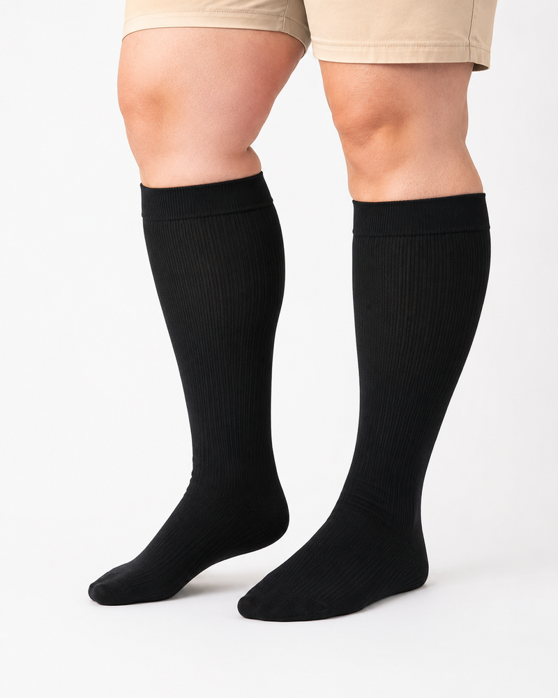 Black plus size wide calf compression socks on full calves plus size wide calf compression socks