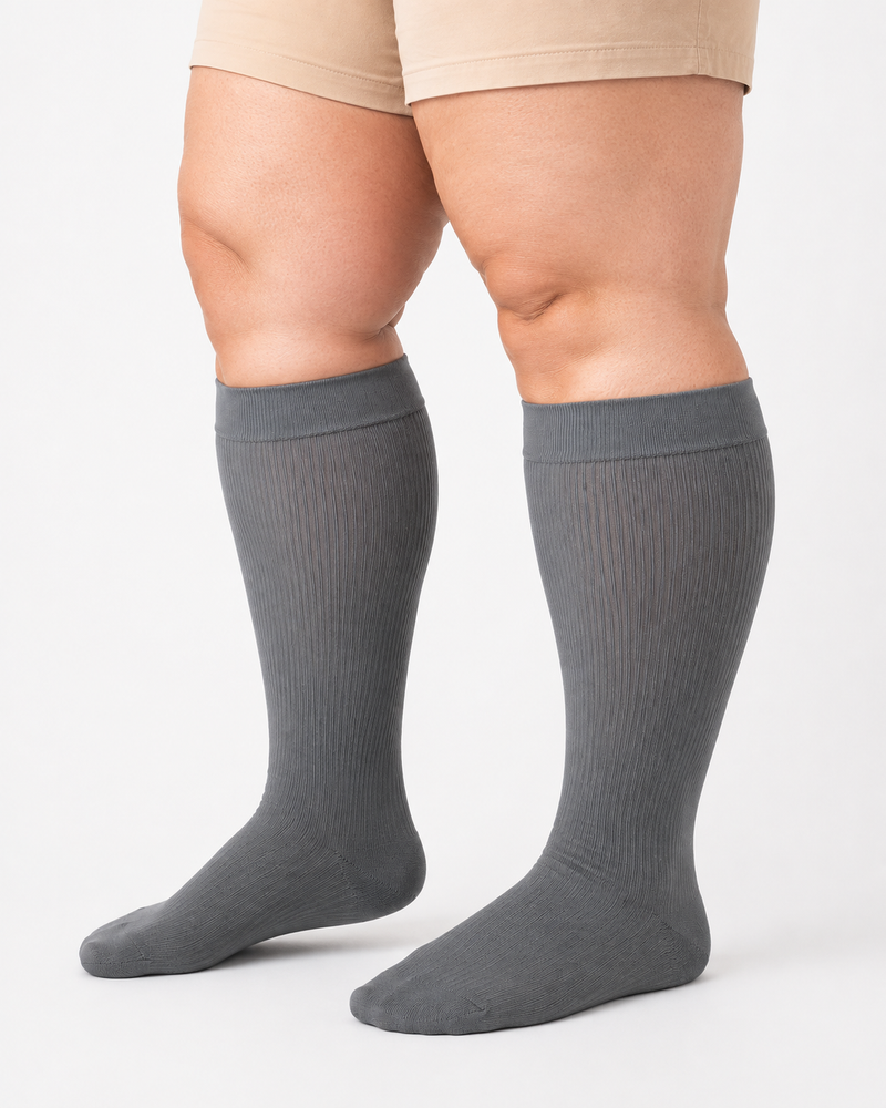 Gray plus size wide calf compression socks on full calves plus size wide calf compression socks
