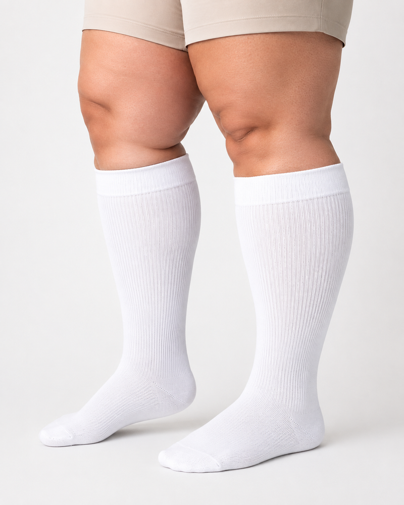 White plus size wide calf compression socks on full calves plus size wide calf compression socks